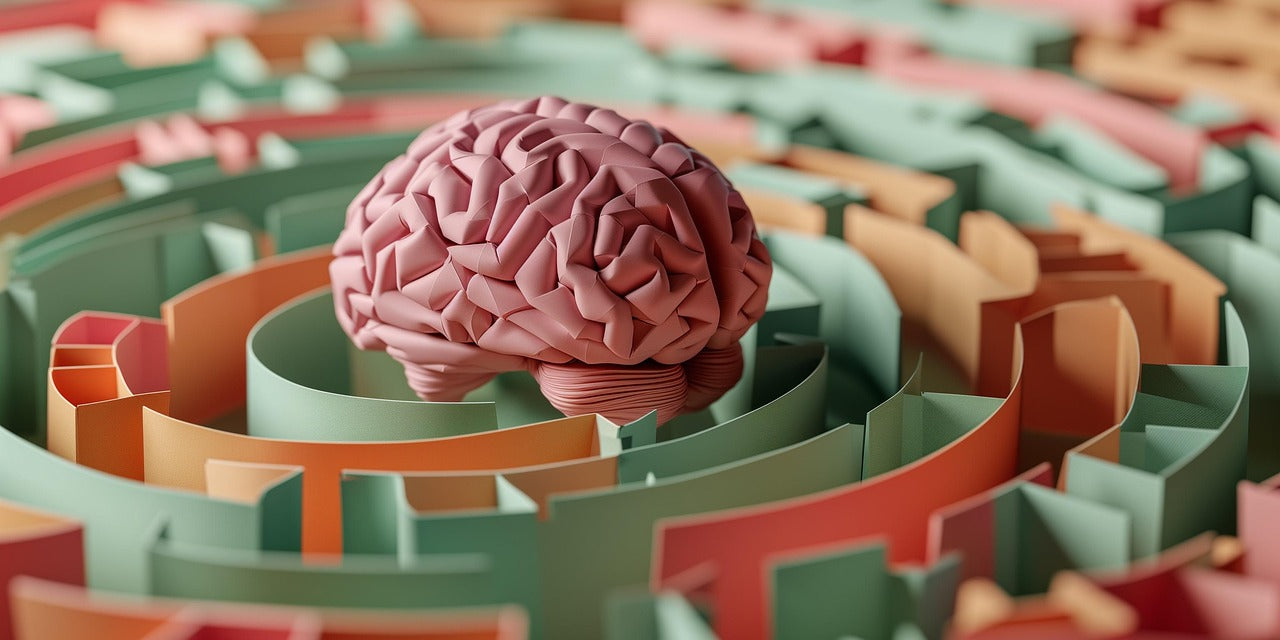 3D illustration of a pink brain inside a colorful maze, symbolizing mental health, problem-solving, and navigating thoughts or challenges.