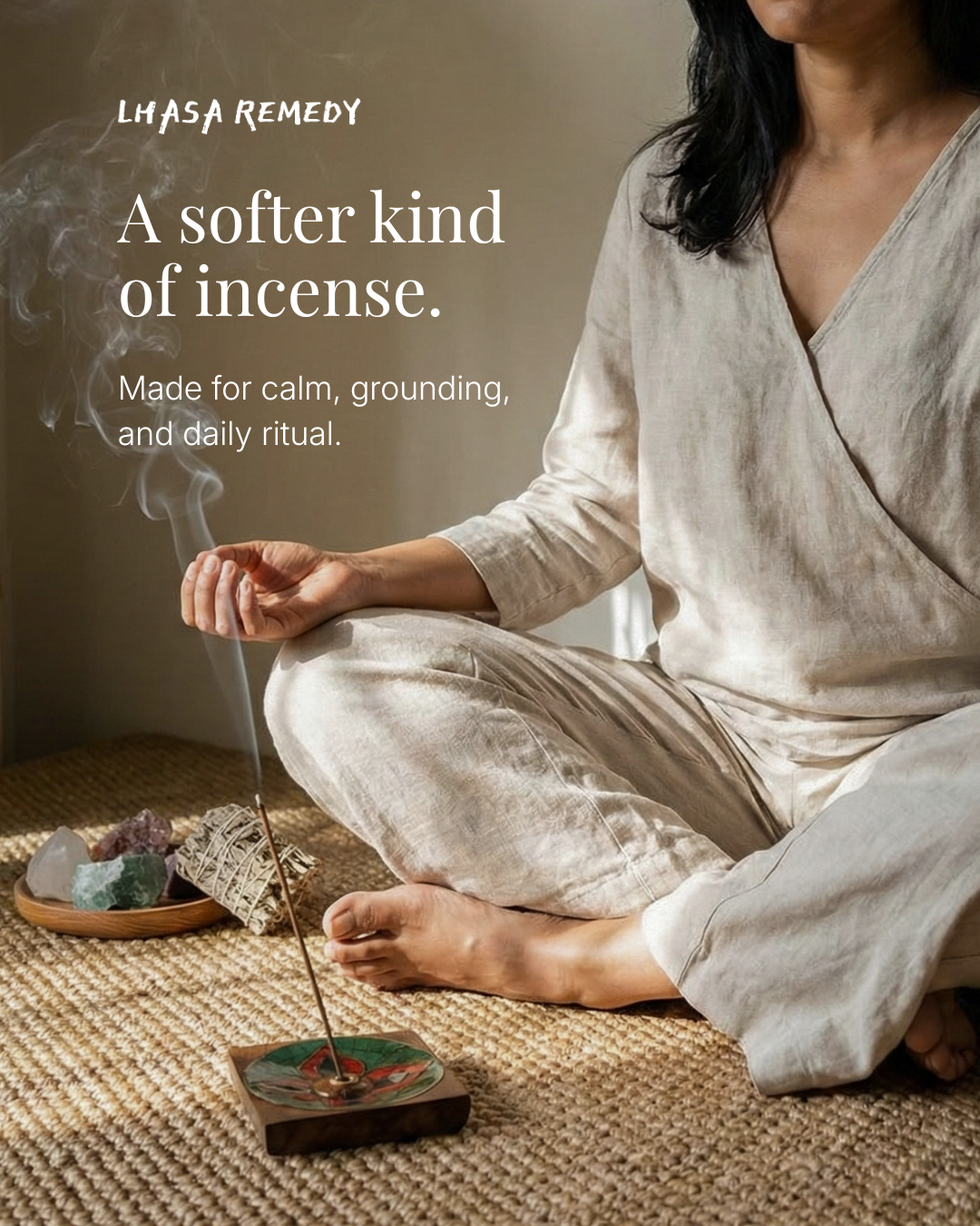 Woman sitting in meditation with incense burning beside her, representing calm, grounding, and daily ritual with Lhasa Remedy incense