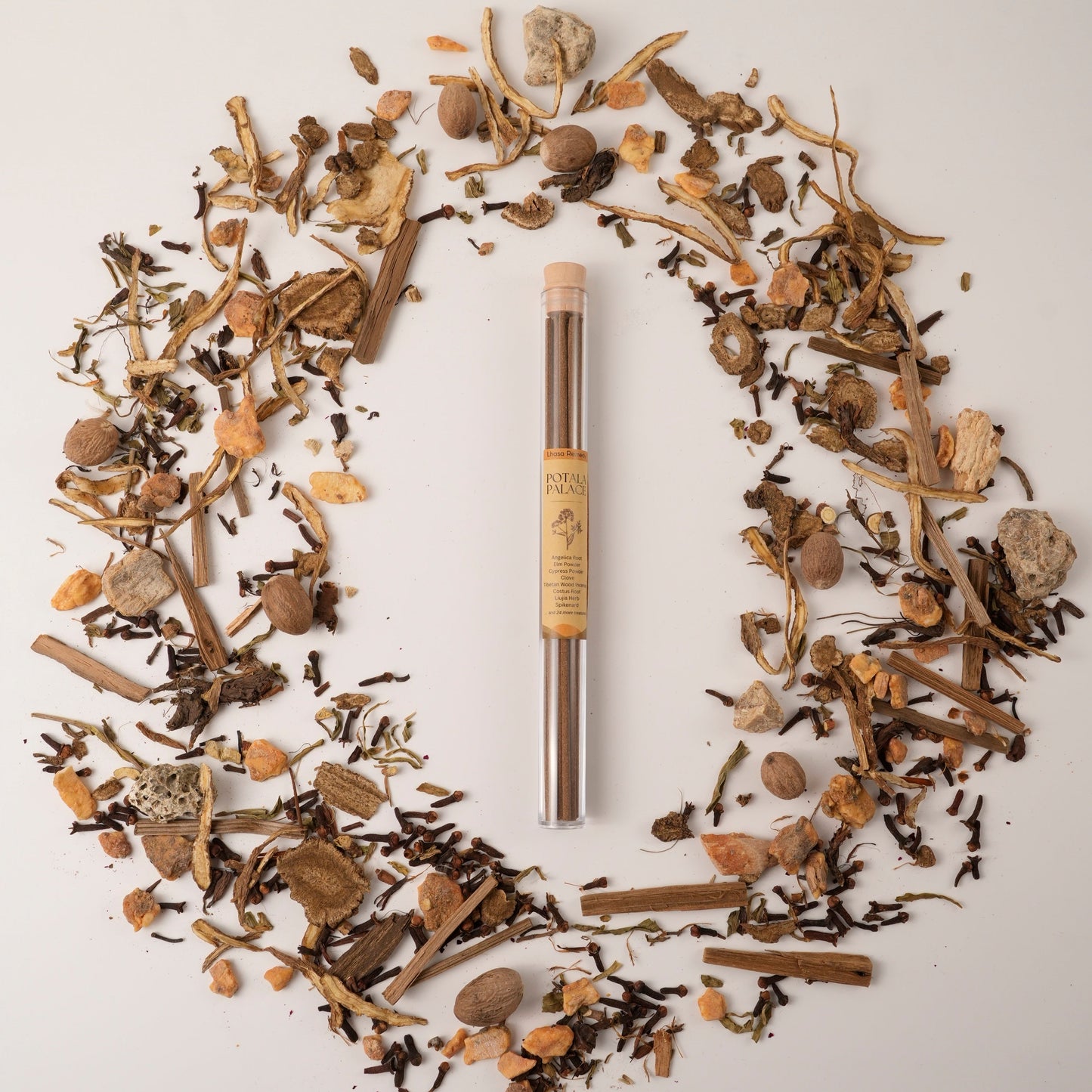 Potala Palace Tibetan incense sticks in a glass tube, surrounded by traditional Chinese medicinal herbs in a circular flat lay.