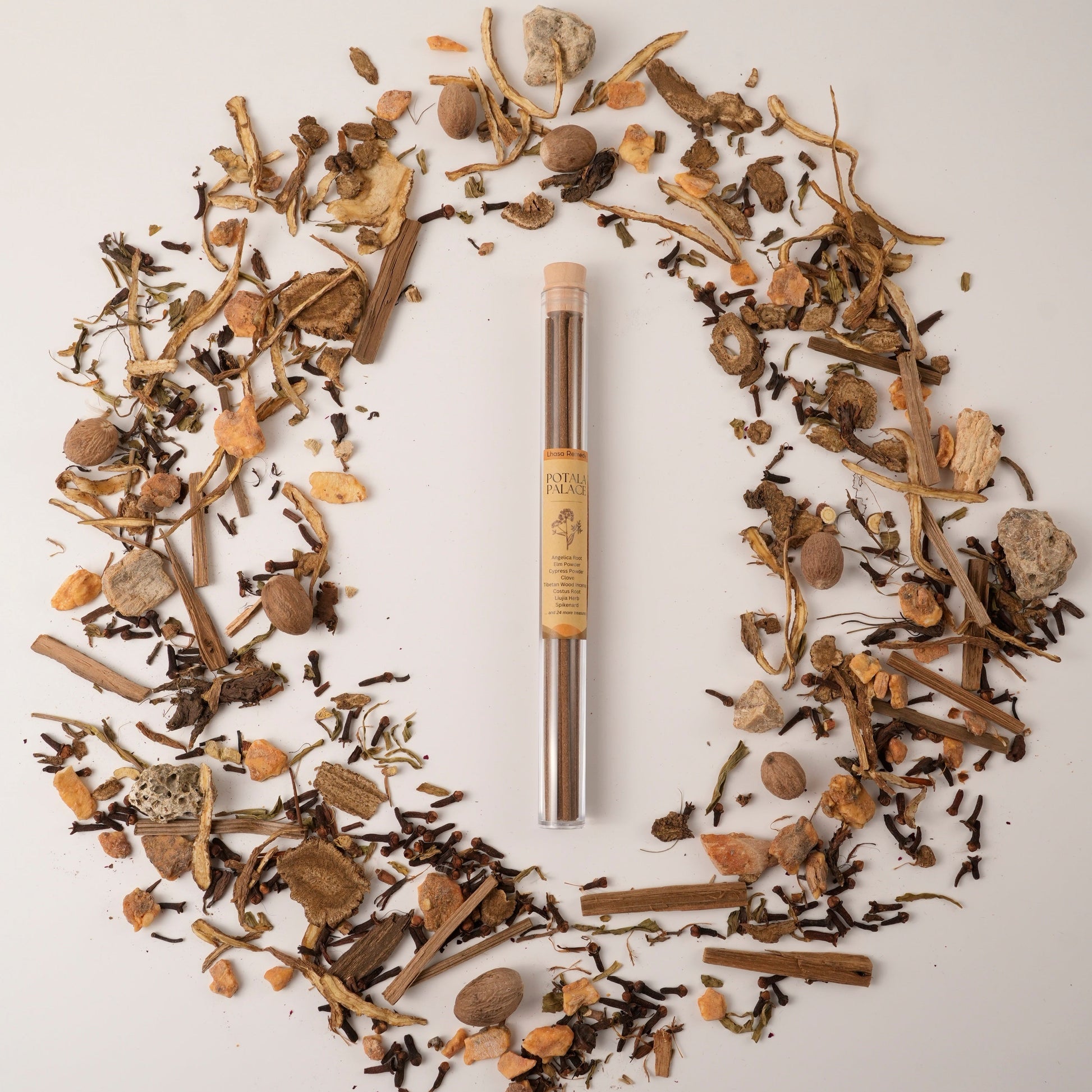 Potala Palace Tibetan incense sticks in a glass tube, surrounded by traditional Chinese medicinal herbs in a circular flat lay.