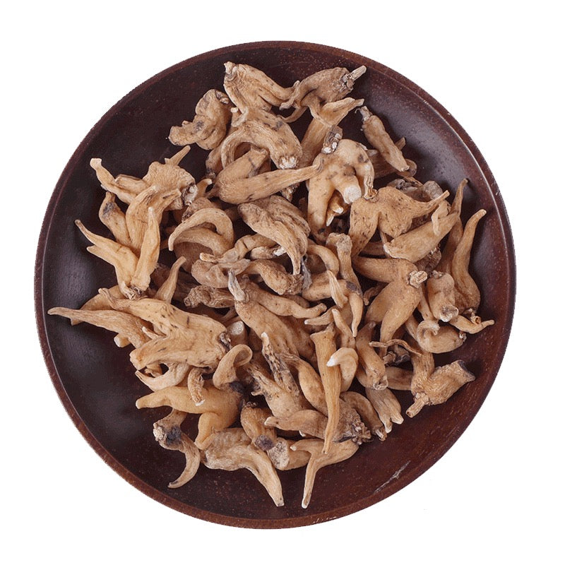 A bowl filled with dried Palm Ginseng roots, a traditional Tibetan medicinal herb known for its adaptogenic and energy-boosting properties.