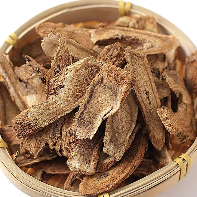 Slices of dried Inula racemosa root in a bamboo basket. This traditional Tibetan and Ayurvedic herb, known as Elecampane, is used to support respiratory health, soothe coughs, and promote lung vitality.
