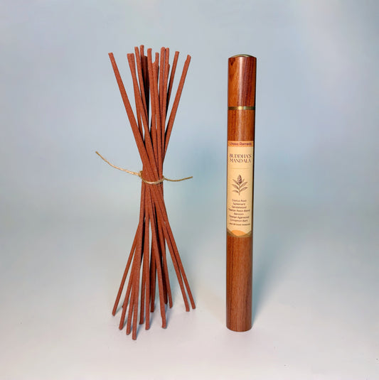Lhasa Remedy’s Buddha’s Mandala Tibetan incense shown with a bundle of handcrafted incense sticks and the wooden storage tube.