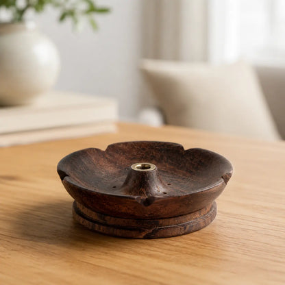 Lhasa Remedy dark walnut wood open petal flower incense holder with brass insert on wooden table
