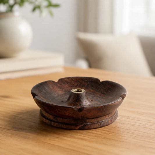 Lhasa Remedy dark walnut wood open petal flower incense holder with brass insert on wooden table