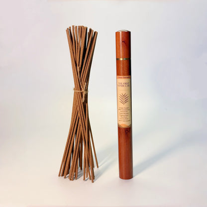 Lhasa Remedy’s The First Sambuchu Tibetan incense displayed with a bundle of handmade incense sticks and the wooden storage tube.