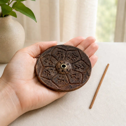 Lhasa Remedy dark walnut wooden round mandala incense holder Tibetan script carving brass center insert macro close-up