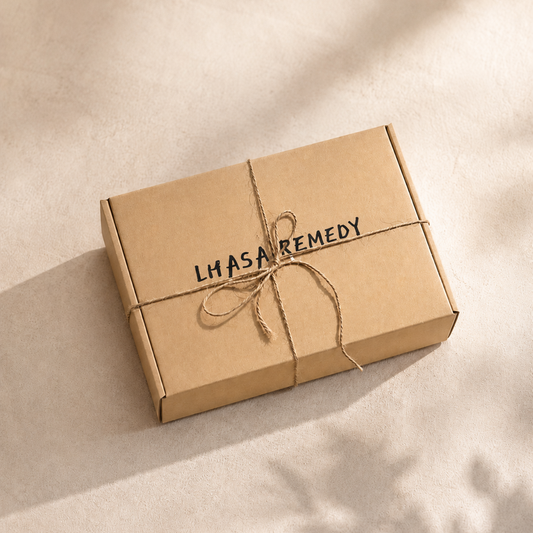 Kraft paper box with 'Lhasa Remedy' branding on a beige background