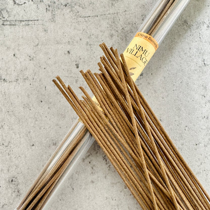 Nimu Village Tibetan incense sticks from Lhasa Remedy displayed spilling from a clear tube, symbolizing sacred heritage and timeless ritual from the heart of Tibet.